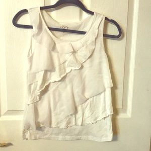 White sleeveless ruffle shirt